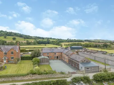 an aerial view of a house with a courtyard at Cor Tarw - Uk12743 in Acrefair