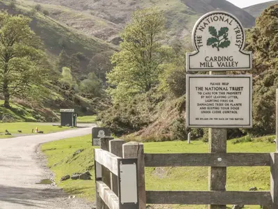 a sign on a fence next to a road at Old Hall Barn 3 in Church Stretton