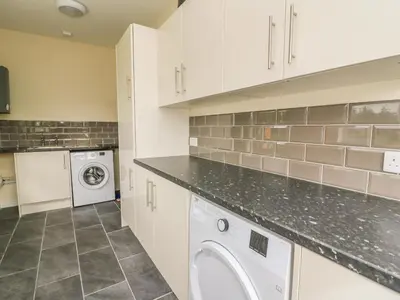 a laundry room with a washer and dryer at New Peny in Llandrindod Wells