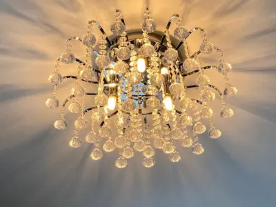 a chandelier hanging from a ceiling at Assembly View - two bedroomed apartment with parking permit in Ludlow Town Centre in Ludlow