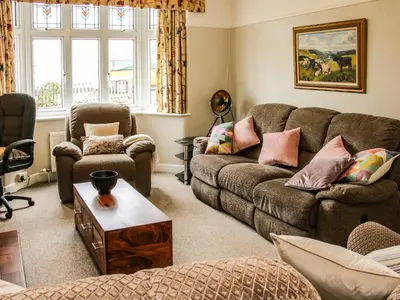 a living room with a couch and two chairs at Sunningdale in Ludlow