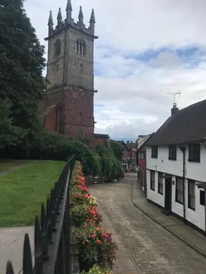 a building with a clock tower in a town at 