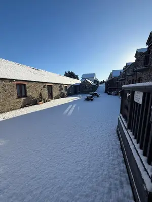 an empty street with snow on the ground at The Hay Suite in Aberystwyth