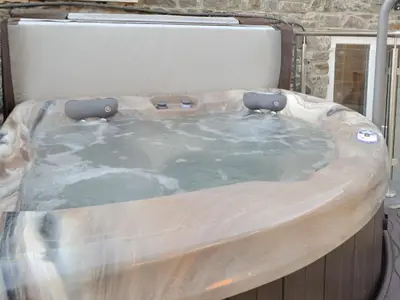 a jacuzzi tub sitting in a room at Cornel Clyd Cosy Corner in Cilcennin