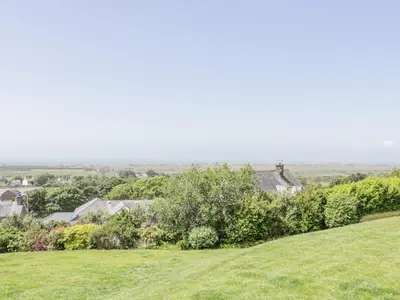 a view from the top of a hill with houses and trees at Bryn Coch Bach in Dyffryn