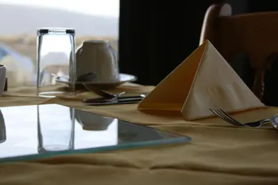 a table with a napkin on top of a table at Oceandrive in Barmouth