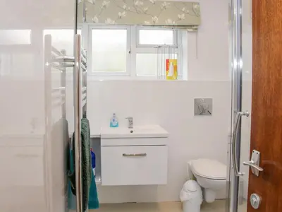 a bathroom with a toilet and a sink at Lane House in Bishops Castle
