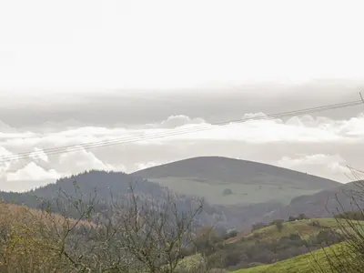 a view of the hills and clouds in the sky at Cranberry Cottage in Shrewsbury