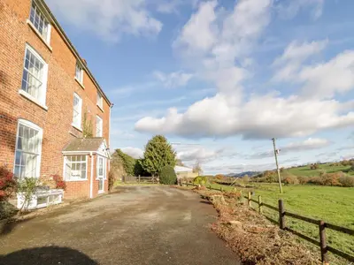 an empty road in front of a brick building at Squires Rest in Welshpool