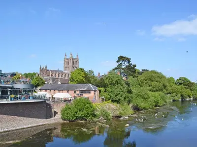 a view of a river with a castle in the background at The Wooden Lodge in Byton