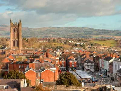 a city with a clock tower and a church at The Wooden Lodge in Byton