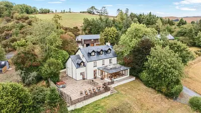 an aerial view of a large white house at Sunny View in Rhayader