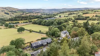 an aerial view of a house in a field at Barn Owl Lodge in Rhayader