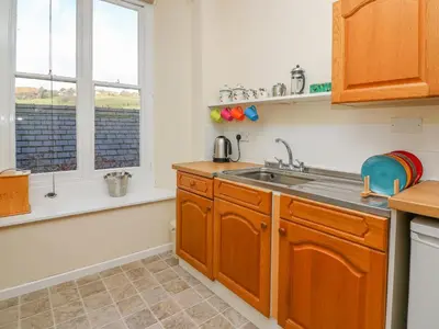 a kitchen with a sink and a window at Garden View in Kington