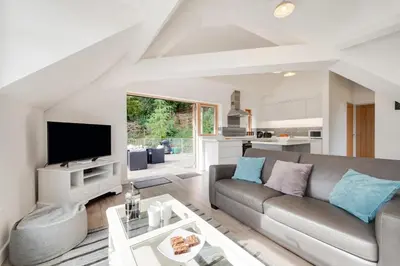 a living room with a couch and a table at 2 Bed in Aberdyfi oc-wah694 in Aberdyfi