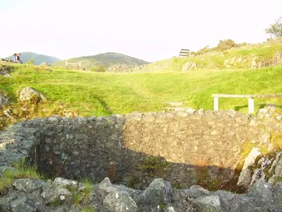 a stone wall on the side of a hill at The Dolgoch in Bryn-crug