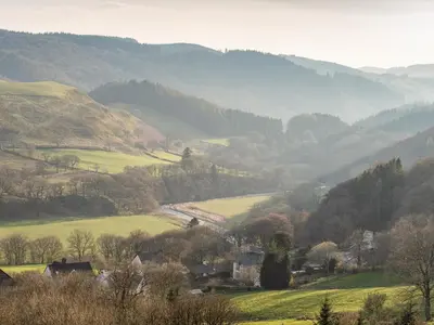 a view of a valley with hills and trees at Haka Lodge in Aberystwyth