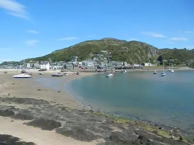 a view of a beach with boats in the water at Seaview Apartment Sleeps 2 -Patio -WiFi -Tv in Barmouth