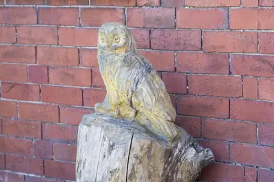 a statue of an owl sitting on top of a wooden post at Finest Retreats - 2 Bed Llangollen Cottage - Sleeps 4 in Llangollen