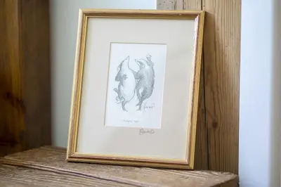 a framed drawing of two cats on a wooden shelf at Finest Retreats - 2 Bed Llangollen Cottage - Sleeps 4 in Llangollen