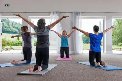 a group of people in aorative yoga class at Pendennis at Eaton Manor in Church Stretton