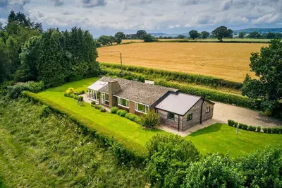 an aerial view of a house in a field at Pendennis at Eaton Manor in Church Stretton