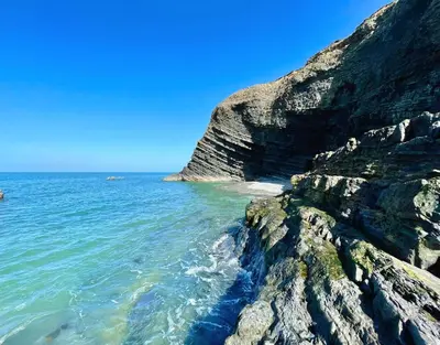 a view of the ocean from a rocky beach at Chalet Kiss of the Sea in Aberystwyth