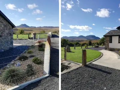 a house and a fence with mountains in the background at Cartref in Trawsfynydd