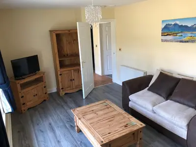 a living room with a couch and a coffee table at Netley Hall in Shrewsbury