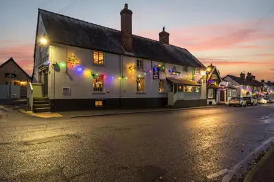 a street in a town at night with christmas lights at The Boars Head Pub in Bishops Castle