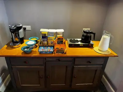 a counter with coffee makers on top of it at Borthwnog Hall in Dolgellau