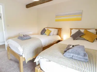 a bedroom with two beds at Bryn Mawndy in Corwen