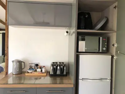 a kitchen with a white refrigerator and a microwave at 8F Lakeside Lodge Caer Beris Builth Wells - No Tradesman in Builth Wells