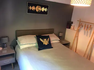 a bedroom with a bed with a blue pillow on it at 8F Lakeside Lodge Caer Beris Builth Wells - No Tradesman in Builth Wells
