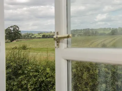 an open window with a view of a field at Conquer Hall in Montgomery