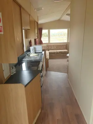 a kitchen with a sink and a counter top at Hill View caravans in Aberystwyth