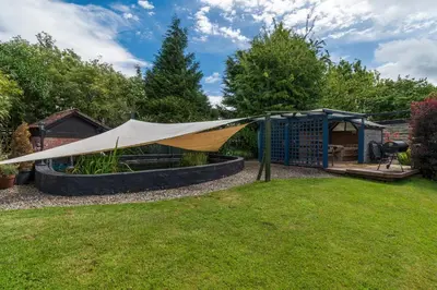 a tent in a garden with a gazebo at Finest Retreats - The Grove Annexe in Craven Arms