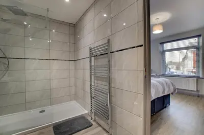 a bathroom with a shower and a bath tub at 5 Bed in Bala oc-bow163 in Bala