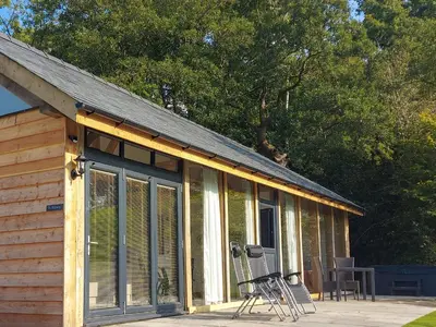 a screened in porch of a cabin with a roof at The Hideaway in Highgate