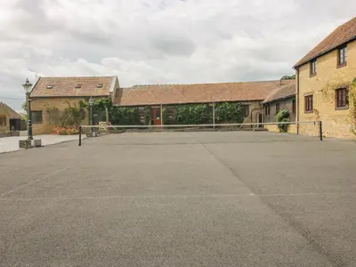 an empty parking lot in front of a building at The Onibury in Craven Arms