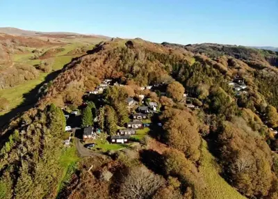 an aerial view of a house on a mountain at Foxs Lair Aberdovey in Aberdyfi