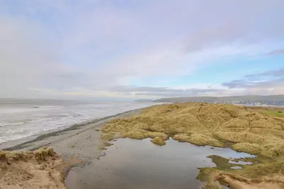 an aerial view of the beach and the ocean at Ystwyth 26 in Borth