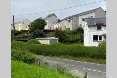 a row of houses on the side of a road at The Little Boat House in Talsarnau