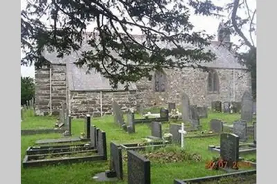 an old stone church with a bunch of graves at The Little Boat House in Talsarnau