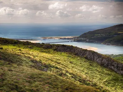 a view of the ocean from a hill at Snowdonia Hideaway in Tywyn
