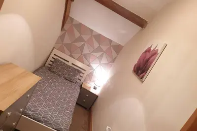 an overhead view of a small attic bedroom with a bed at Cosy Minffordd Let - Llanuwchllyn near, Bala LL23 in Bala
