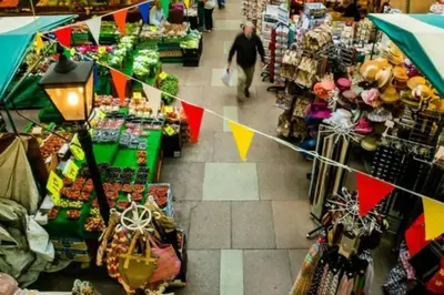 an overhead view of a market with a man walking through a store at Luxury townhouse in town centre, views, river walk, Free Parking in Shrewsbury