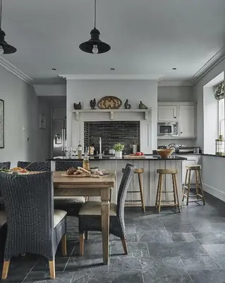a kitchen and dining room with a table and chairs at Tan Llan in Dolgellau