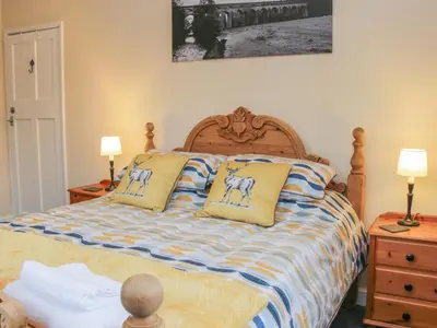 a bedroom with a bed with two pillows on it at Belmont Bridge in Oswestry
