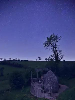 a large pile of rocks in a field at night at HOBLEY House Holiday in Craven Arms